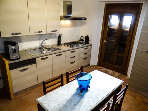 Kitchen and Door to Balcony and Views