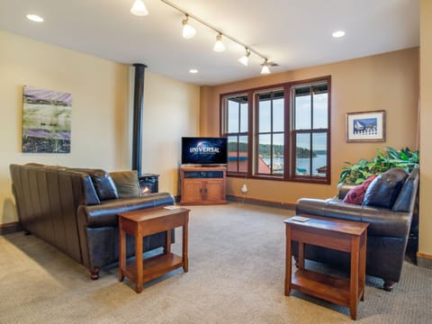 The living room boasts two couches, a propane fireplace and Satellite TV.