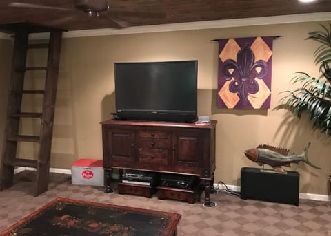 Game room/5th bedroom with wet bar and foos ball table and lake view. 