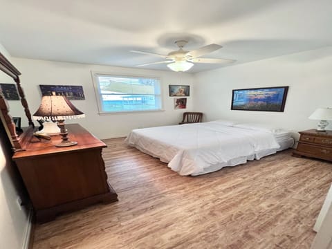 Middle room is a queen bed room with closet and dresser.  Has view of bay.