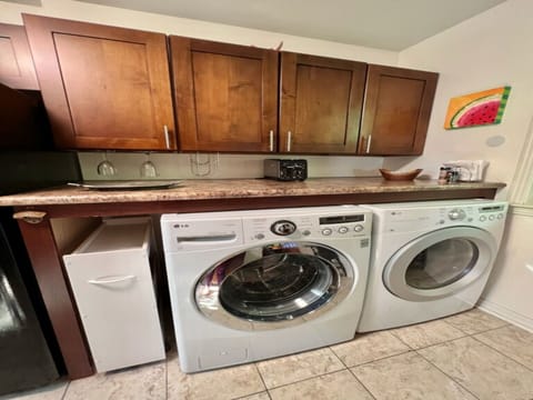 Full size washer and dryer in the kitchen.