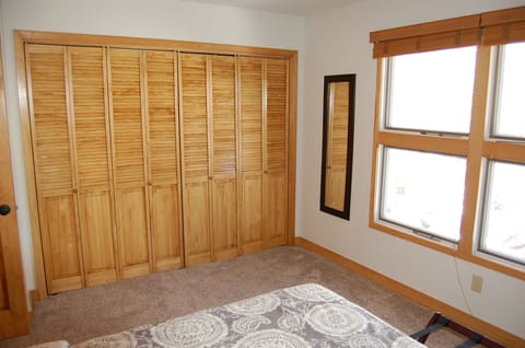 Guest bedroom with lots of closet space.
