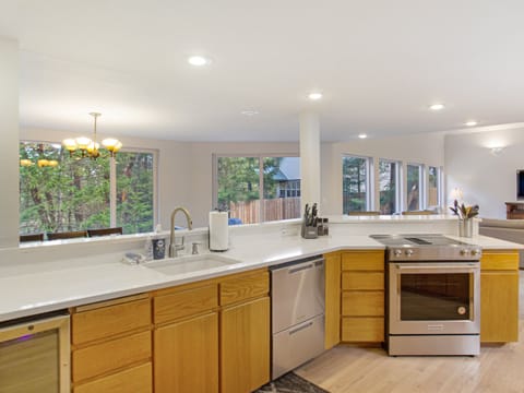 Newly updated and fully stocked kitchen with wine fridge.
