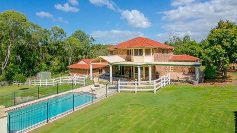 A beautiful home in an acreage estate, half way between Brisbane & Gold Coast.