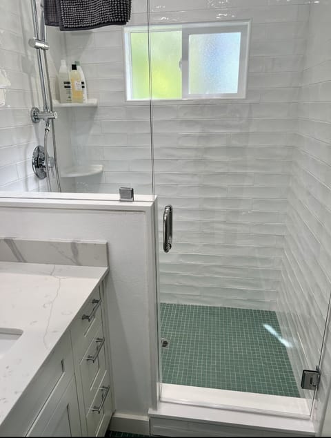 Combined shower/tub, hair dryer, towels, soap