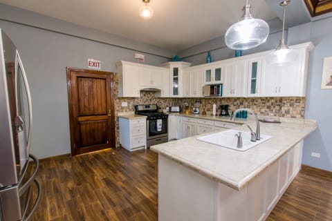 Kitchen with granite counter tops and stainless appliances 