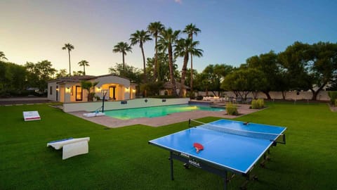 Backyard designed for fun w/ pool, spa, ping pong, corn hole, sports, & more
