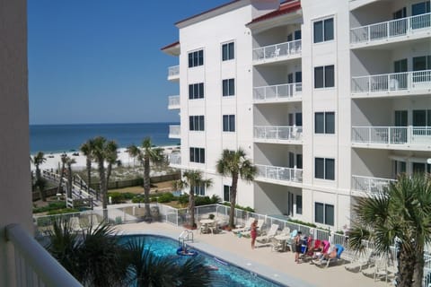 A view from the balcony to the Pool and Beach