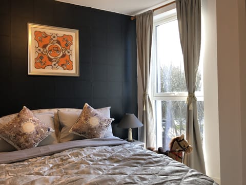 The bright and spacious bedroom with Hermes fabrics