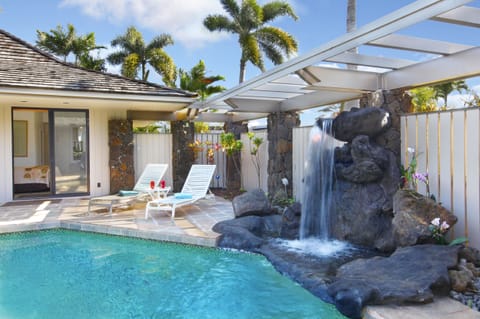 Beautiful private Hawaiian waterfall and pool, with seating and lounging room for all!
