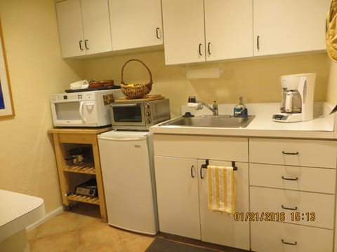 The kitchenette with sink and coffeepotmaker;microwave;fridge;
oven/toaster.