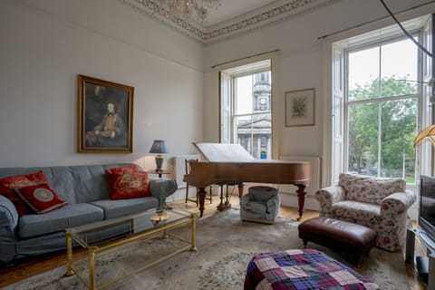 Elegant first floor living room with a boudoir grand Bechstein piano.