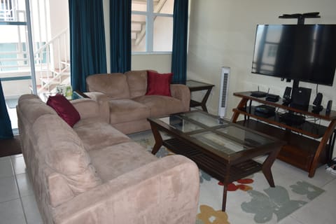 Comfortable living room area with sofa and loveseat.  Cable TV and WIFI access.