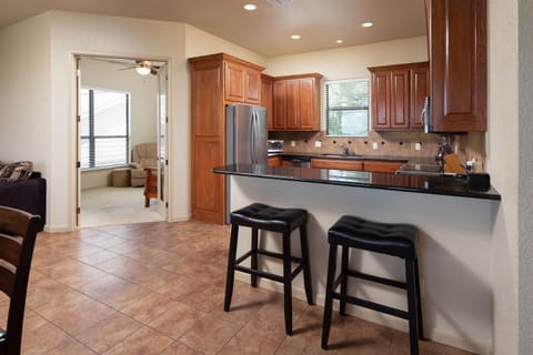 Breakfast bar in Kitchen and view of the den.