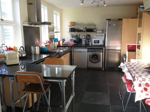 large kitchen showing four seater table