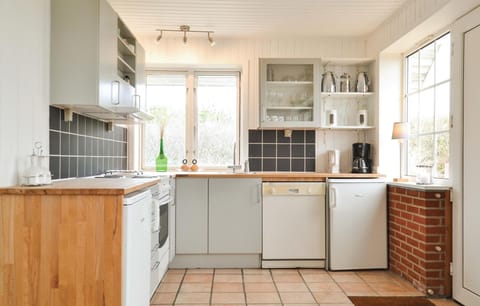 Fridge, stovetop, dishwasher, coffee/tea maker