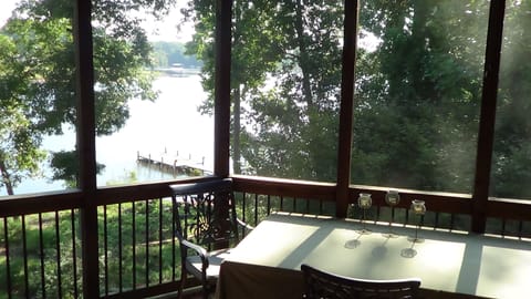 Screened in porch overlooking lake