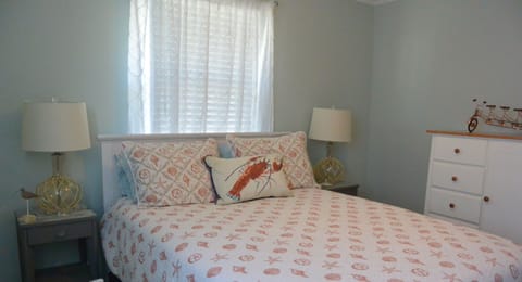 Coral bedroom with queen bed