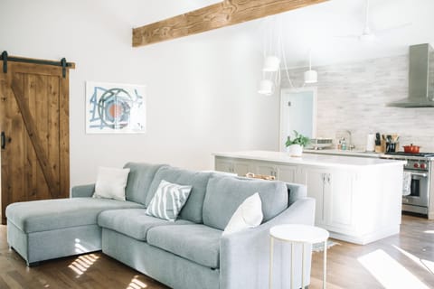 The chaise loune hides blankets and pillows.