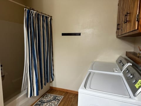 Combined shower/tub, hair dryer, towels, soap