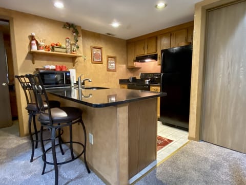 Updates To Kitchen Include Granite Breakfast Bar And Appliances
