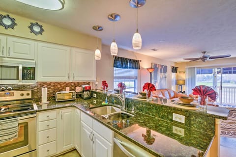 Admire the granite counters and stainless steel appliances.