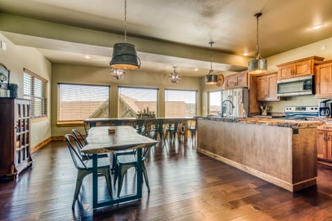 Open kitchen with lots of seating around the handmade live edge tables