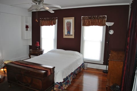 Master bedroom with antique furnishings and queen bed