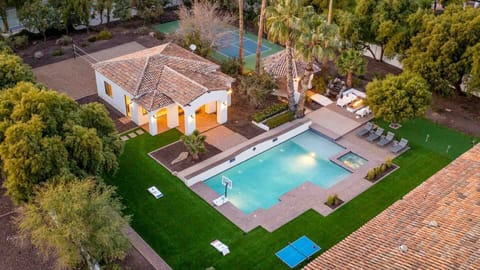 Expansive backyard with a pool, spa, sport court, and plenty of space to play.