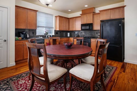 Dining table expands to seat up to 10. The cover also reverses for a green felt surface for games.
