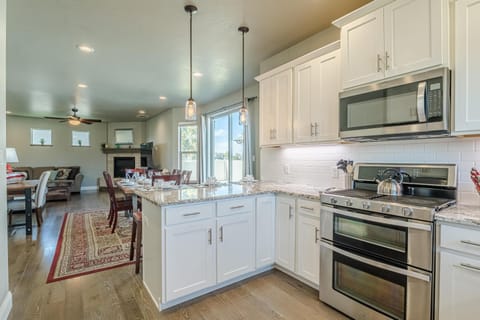 Bright, open kitchen with modern appliances and cozy dining area