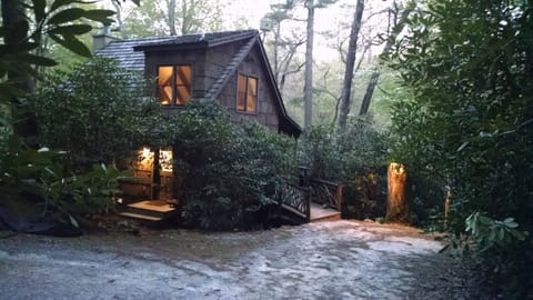 Your cozy,  bark-covered cottage in the woods awaits...step inside...