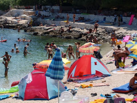 On the beach, sun loungers, beach towels