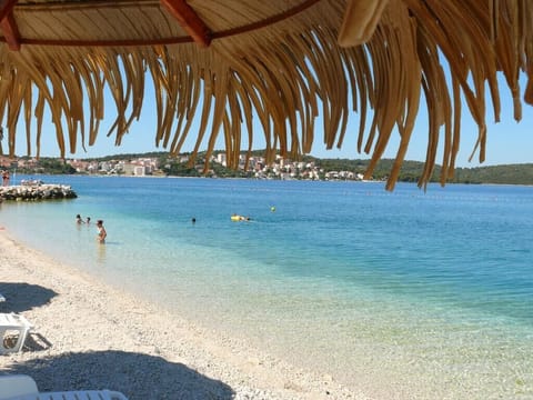 On the beach, sun loungers, beach towels