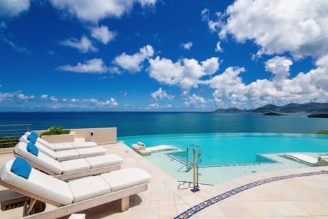 An infinity pool, sun loungers