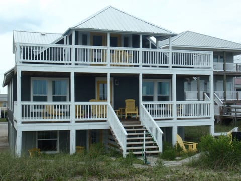 Photo shows lower left back patio accommodation. Patio view backyard and dunes
