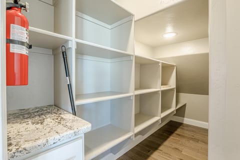 Spacious pantry with ample shelving for organized storage
