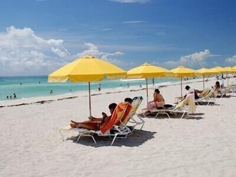 On the beach, sun loungers, beach towels