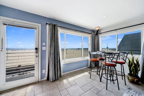 View of dining area and beach views from living room
