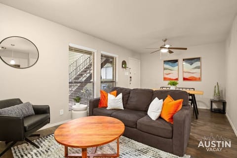 Living room with sleeper sofa, conversation seating and smart TV