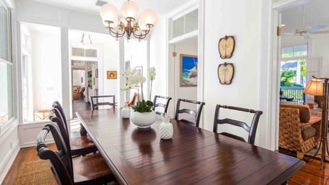 The formal dining room has a large table with seating for 8...