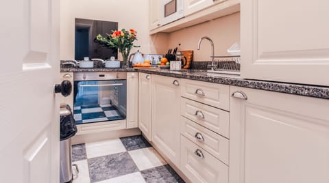 Kitchen washing machine, fridge and freezer view