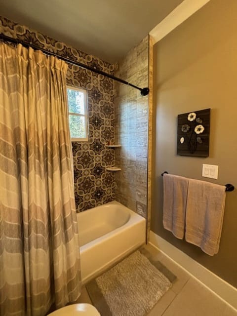 Combined shower/tub, hair dryer, towels, soap