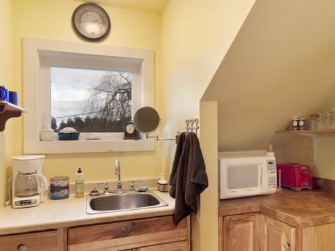 Kitchenette area with window view 

**Kitchenette includes mini fridge, microwave, coffee maker, plates, cups. Toaster available upon request.**