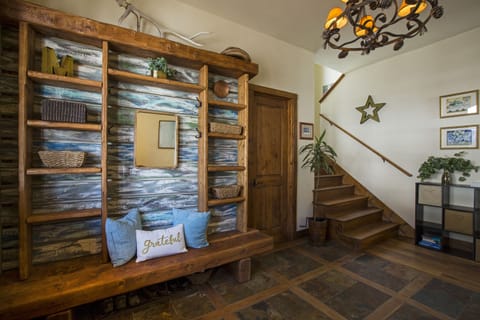 Entryway with custom made bench and shelves.