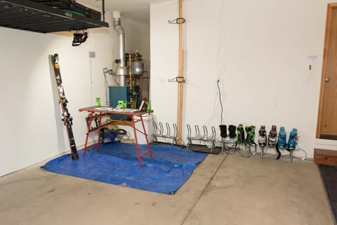 Heated 1 car garage with ski racks, boot dryers, ski tuning table and bike racks