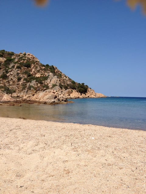 On the beach, sun loungers, beach towels