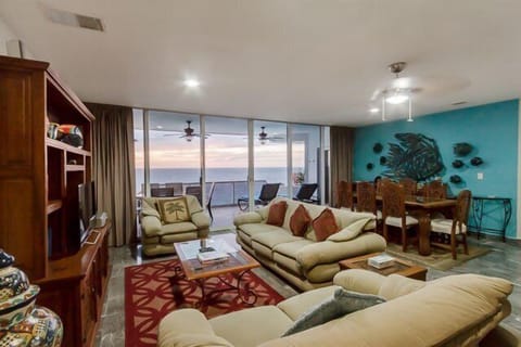 The well appointed living room provides ample seating plus endless views of the ocean