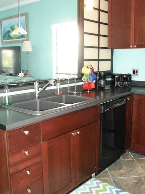 Kitchen looks into Living Room