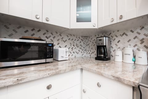 The Kitchen has all you need for a great stay. Microwave, coffee maker, toaster, we even provide coffee, tea and creamer.
